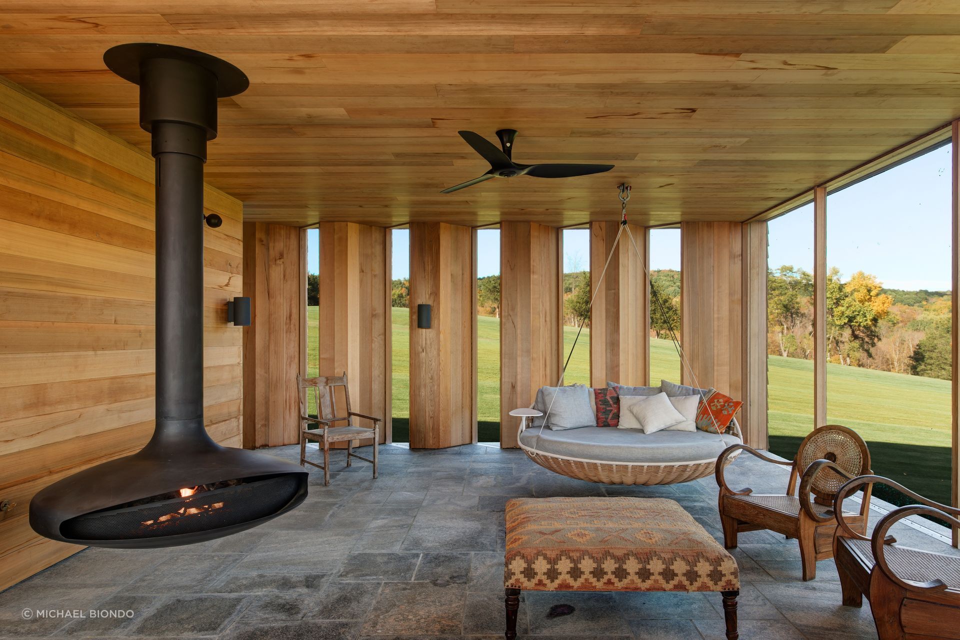 The screened porch that sits below the primary suite