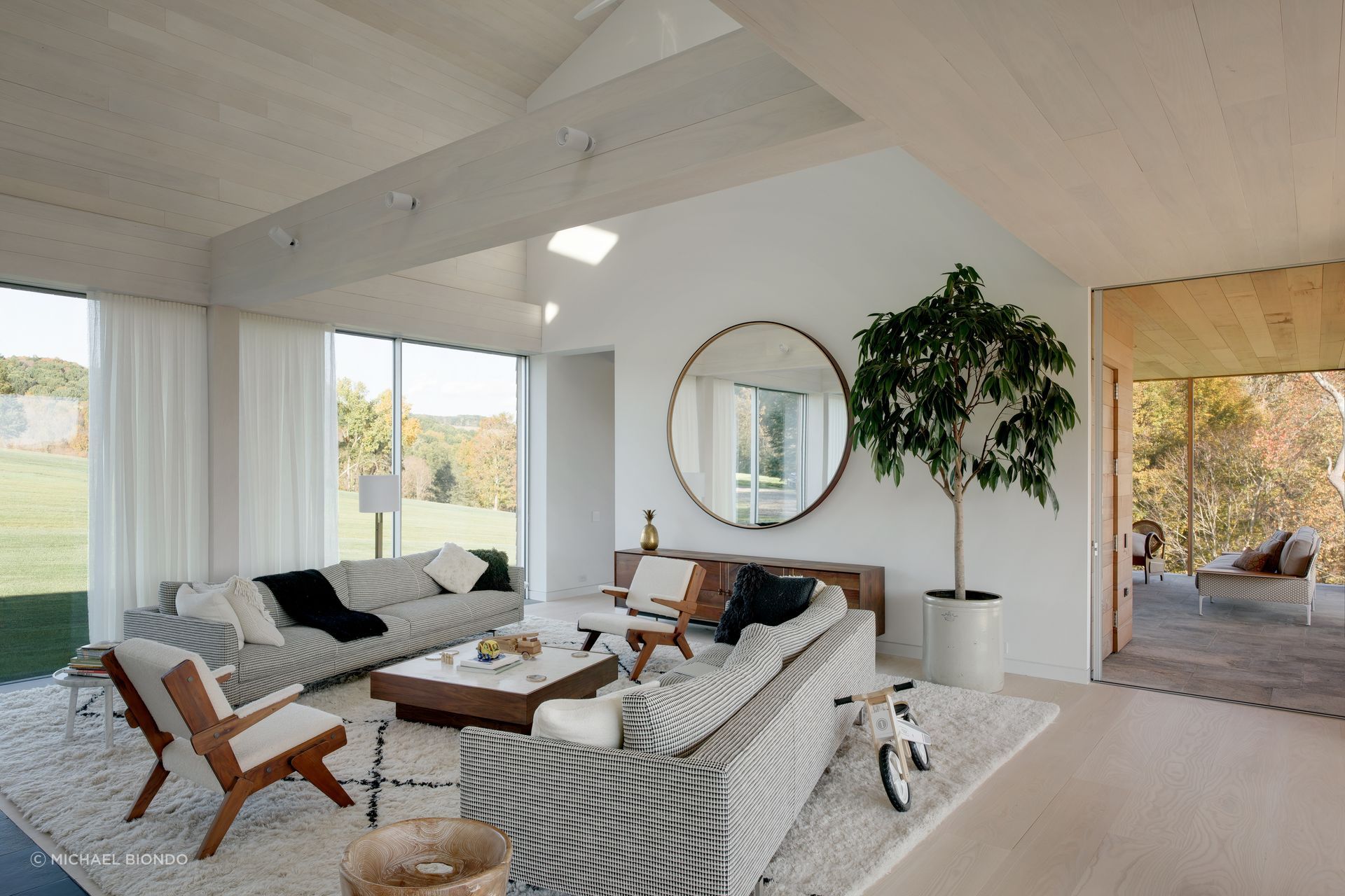 To the right of the living room is the entry to a screened porch with sweeping views across the valley to one side.