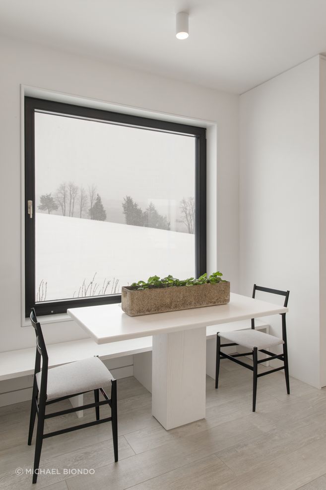 The cozy dining nook overlooking the compound's approach.