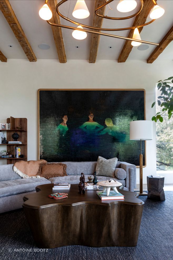 On one end of the living room hangs a puzzle painting by Tyler Hays of BDDW.