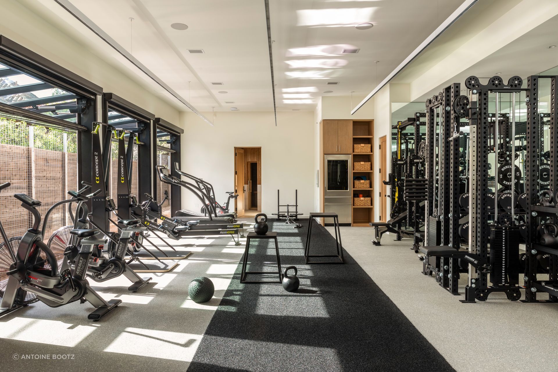 A separate new structure behind the main house holds a home gym and recovery room along with an office for the husband, an entrepreneur and athlete who trains when he isn’t working.