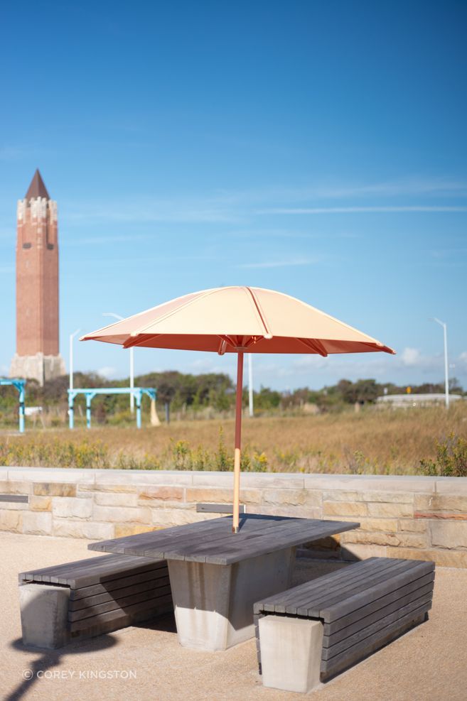 New metal umbrellas, and concrete benches as part of Andrew Cuomo’s $100 million dollar expansion project completed in 2016. Photo by Corey Kingston.