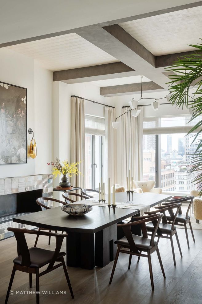 This sleek Manhattan pied-a-terre features an interesting mix of vintage and contemporary furniture, including hand-carved chairs from Japan. The Zuninos' friend, Jeff Martin, a Vancouver based artist, created the earthy fireplace tiles.