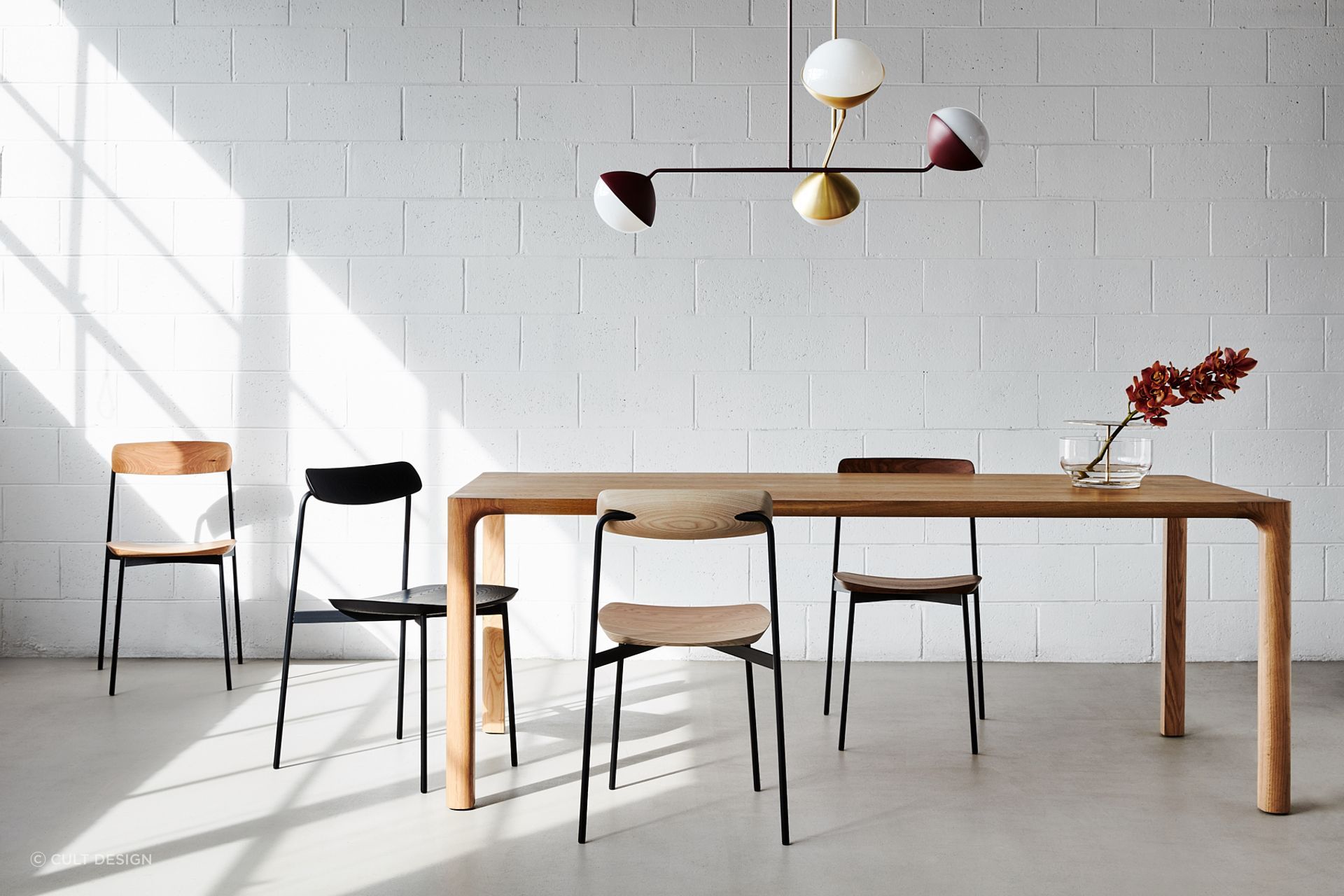 You can go with a number of pendant lights or a multi-pendant light like the Jolly Pendant by NAU