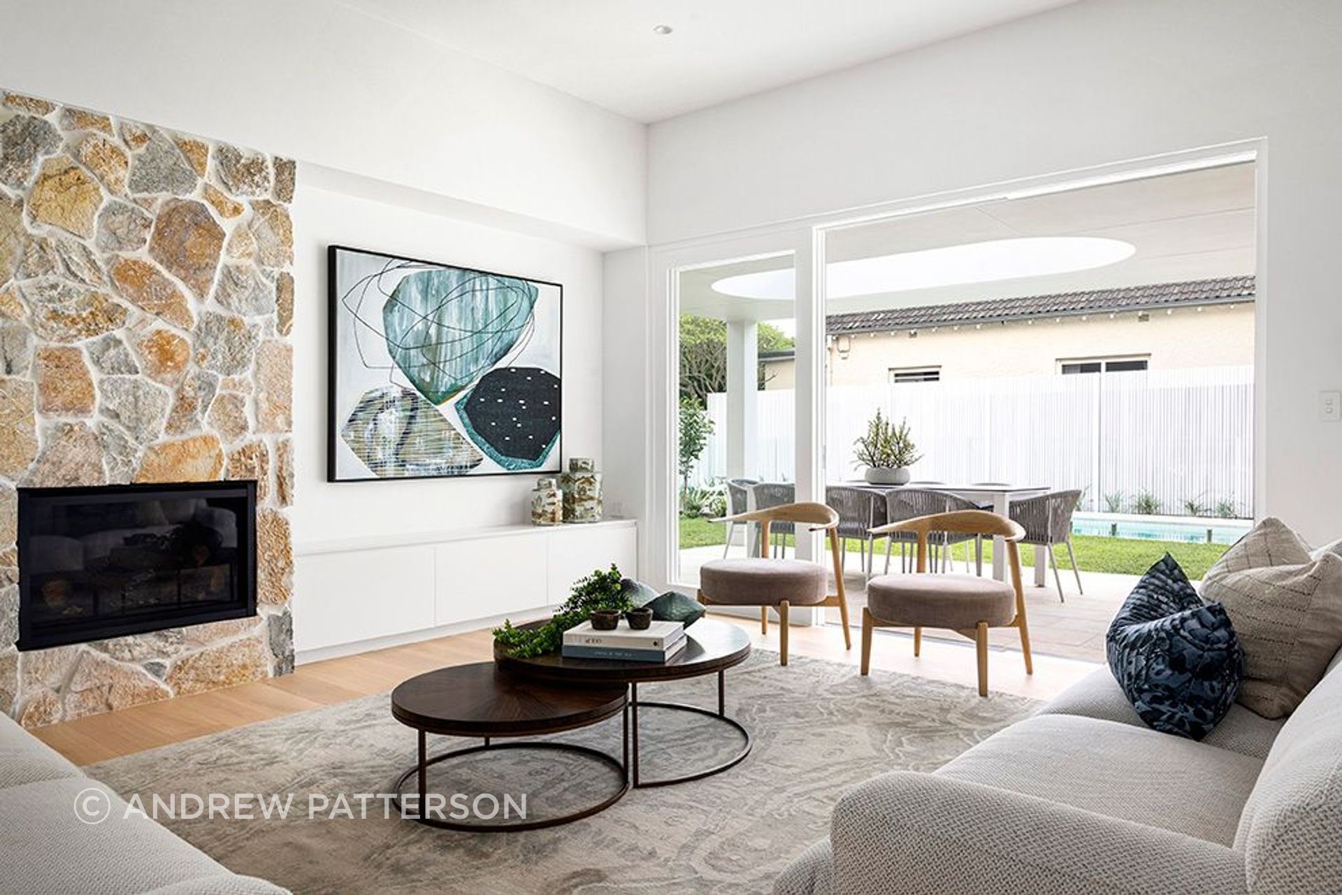Summit wall cladding as a fireplace feature wall. Where the indoors opens to the outdoors, stone holds its place.