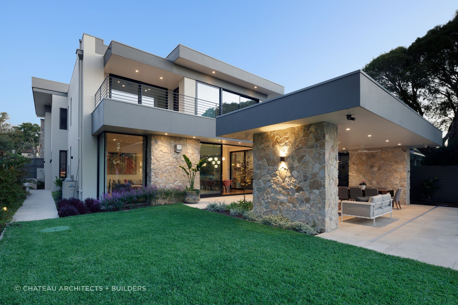 Summit wall cladding at dusk. Stone columns and feature walls that give this Seaforth home its character.