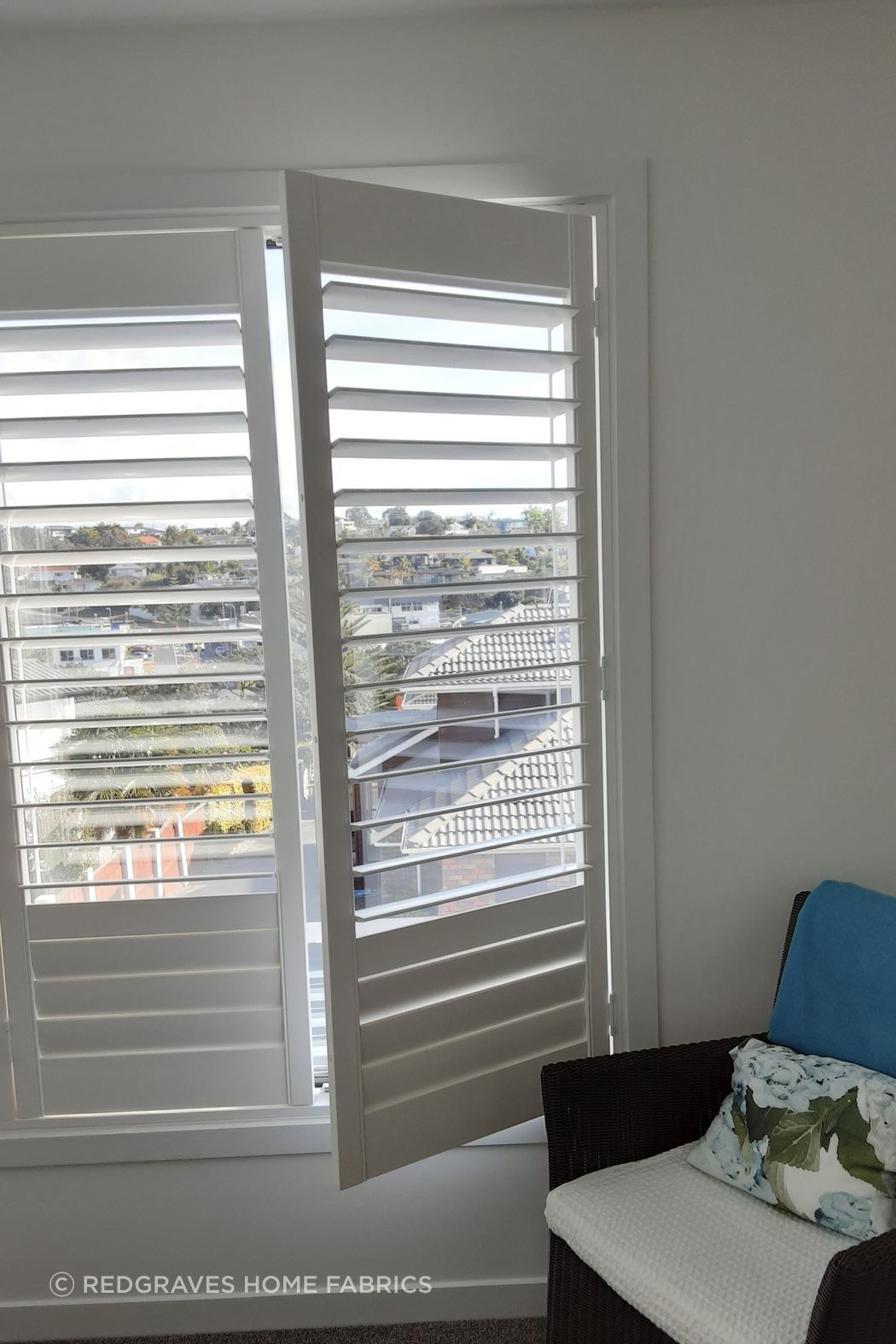 Hinged shutter on bedroom window