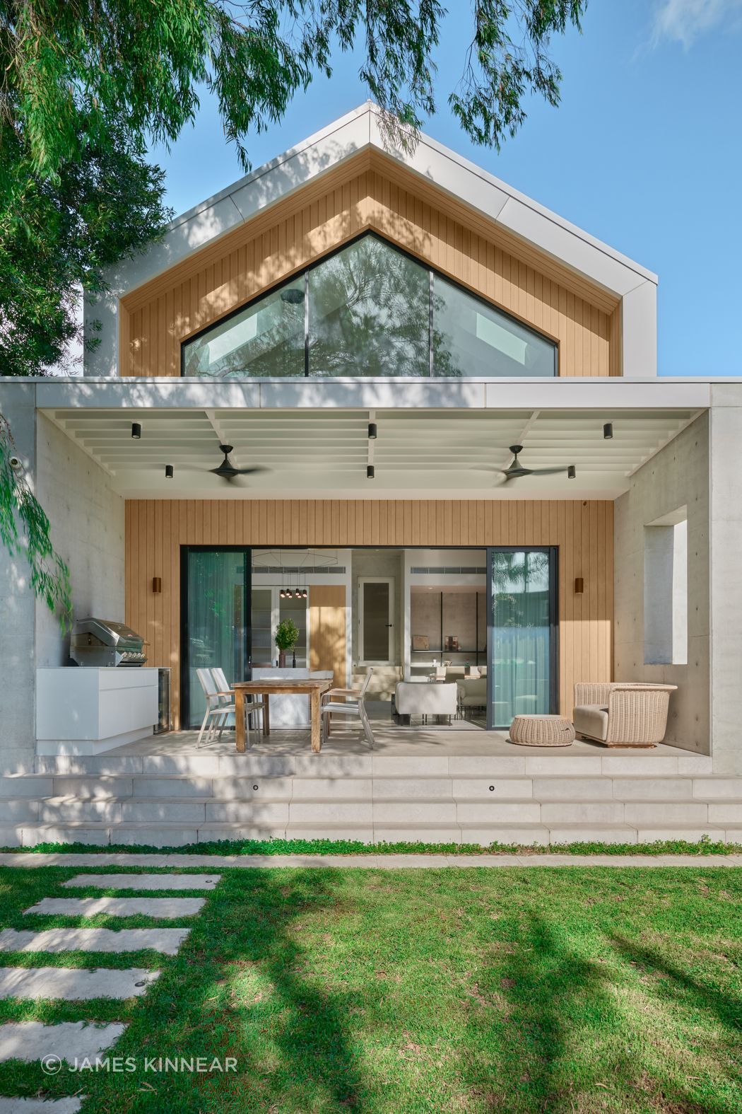 Gable House in Kensington by SSD Studios. Blending Chinese and Irish heritage with European barn-style architecture, Luna Chiaro Limestone flows seamlessly from interior to outdoor entertaining areas. A 2025 project where cultural layers and natural materials unite.