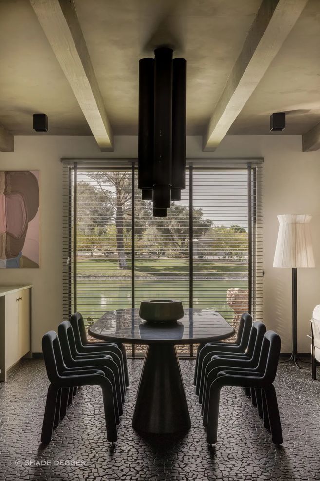 Moustache chairs surround the dining area’s Dirk Van der Kooij table; chandeliers by Pierre Szekely. Art: José Lerma