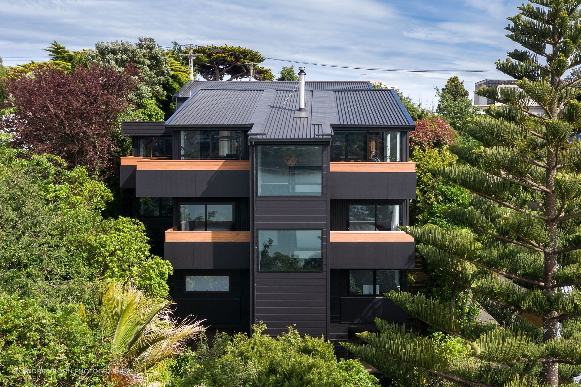 The house’s protective facade, designed to enhance views from the interior out across the harbour.