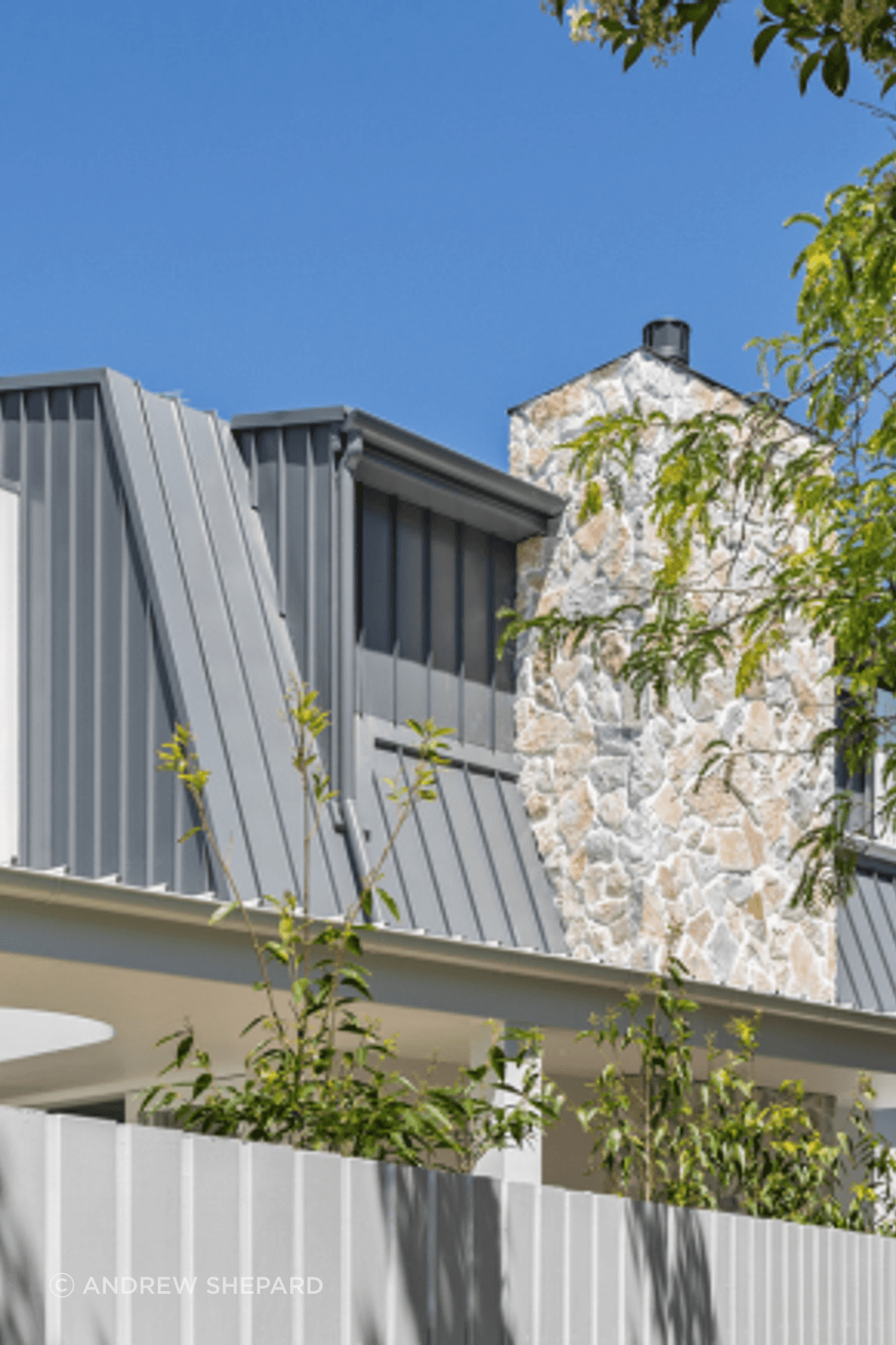 Summit wall cladding on the chimney exterior. Stone that holds its own against any facade.