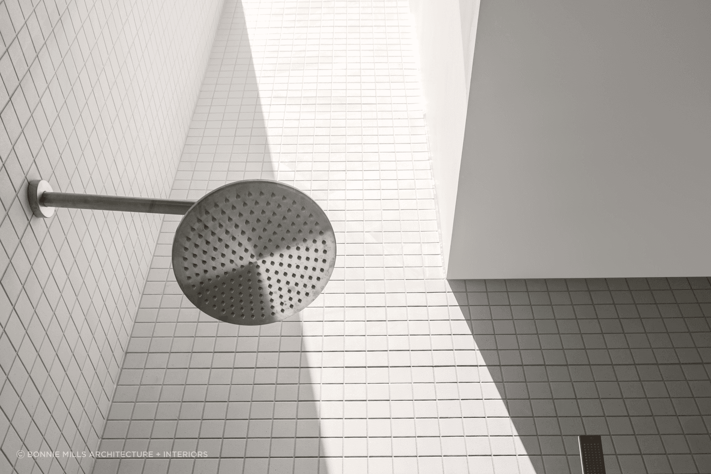 Rain shower heads disperse water evenly to simulate the feeling of rainfall for a soothing experience. Featured project: Brighton East Residence