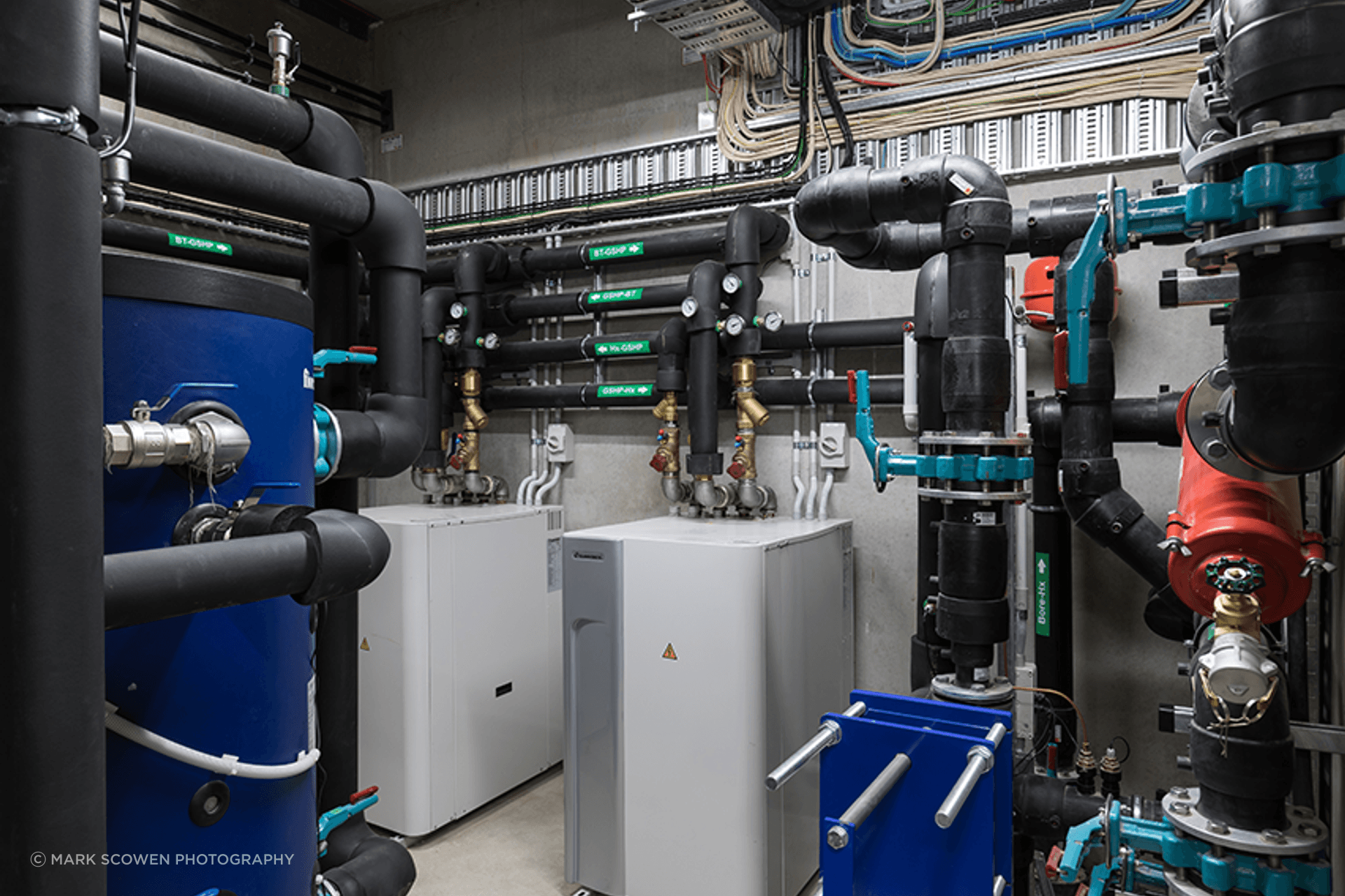 Cosgroves designed and installed a mechanical and hydraulic solution for Blum that includes a perimeter trench heating system fed via an open loop ground-source heat pump system, as well as a natural ventilation system controlled by an automated weather s