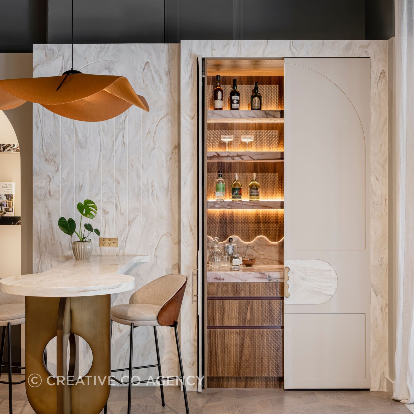 Surprise and Delight.  This gorgeous hidden bar features elevated luxe materials, and technical innovation in hardware.