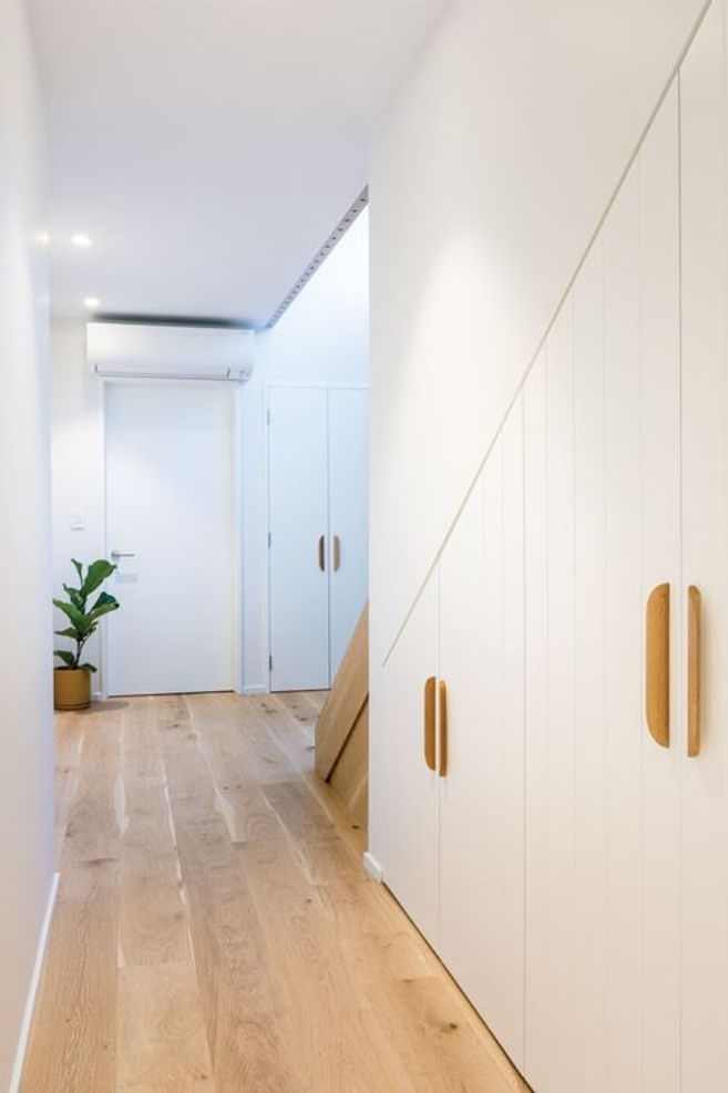 NATURAL WARMTH Engineered wooden flooring in the living areas and woollen Bremworth carpets in the bedrooms are from The Flooring Centre.