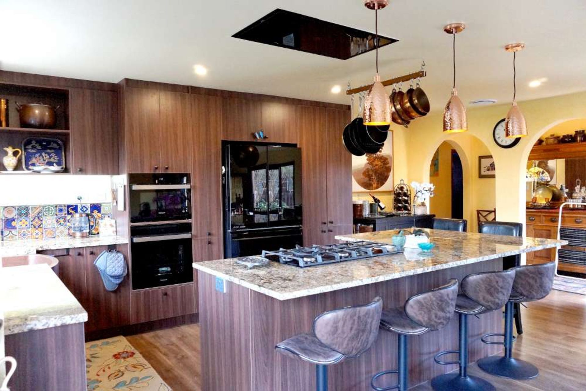 After demolishing the wall between the kitchen and lounge was demolished, we were able to create a large open style kitchen for Mary.