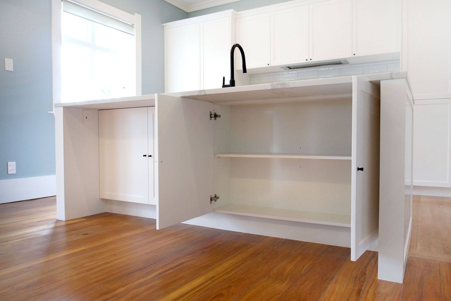 Breakfast Island with cabinets on both sides for added storage (Kitchen renovation in Epsom)