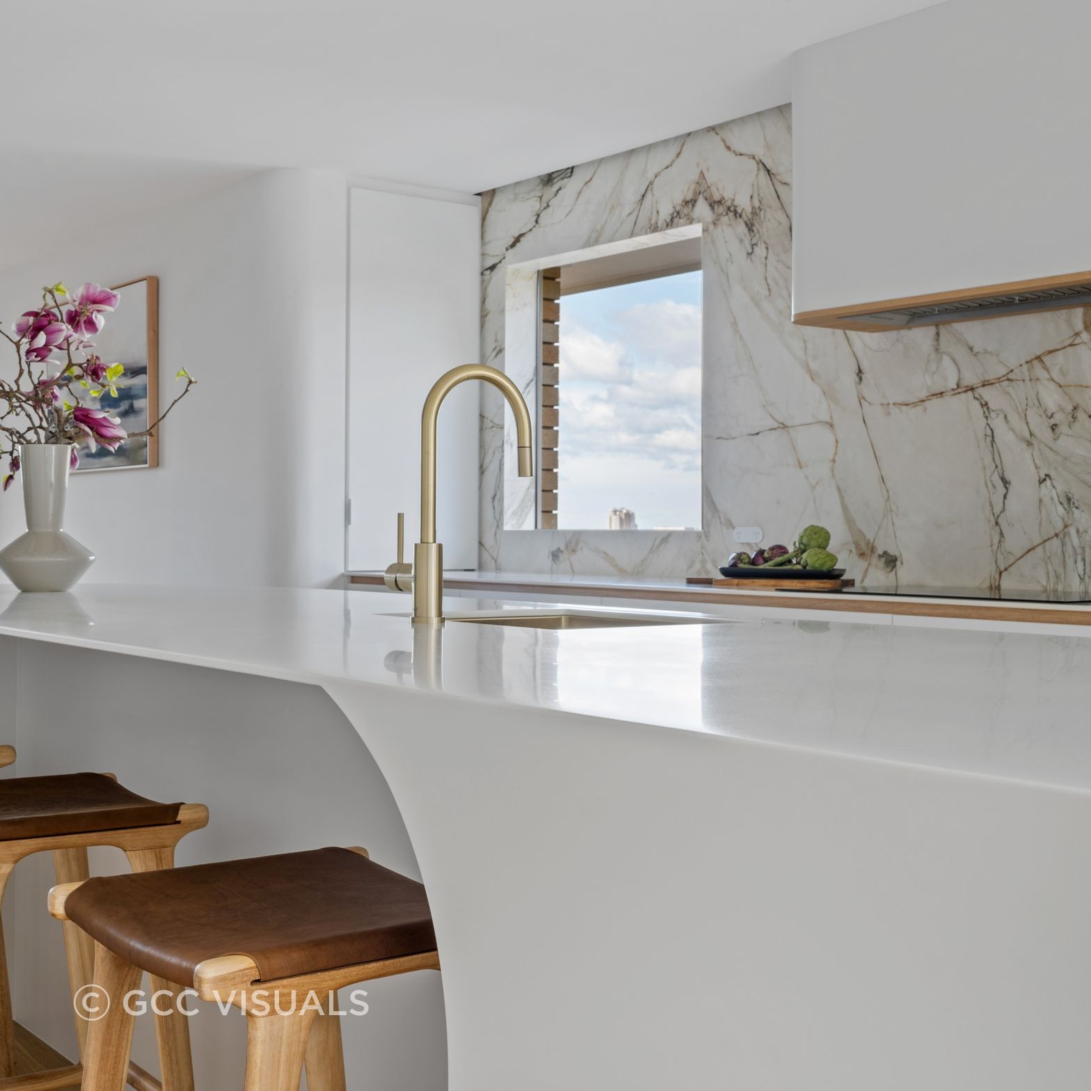The Avenue.  Coastal inspired living. Warm neutral palette, Corian curved statement island and Neolith feature stone.