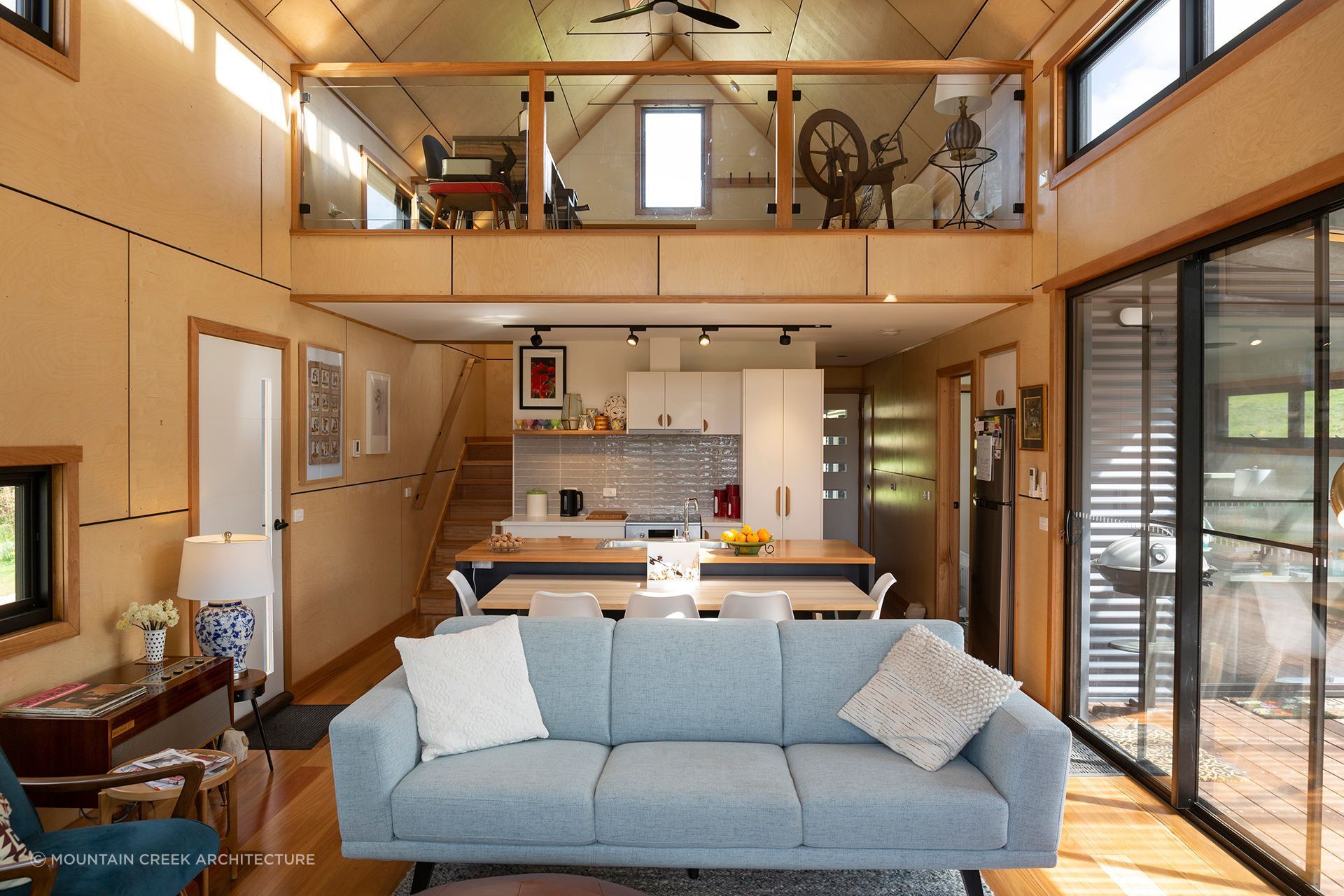 The living area skilfully optimises space. Photographer: Charlie Brown.
