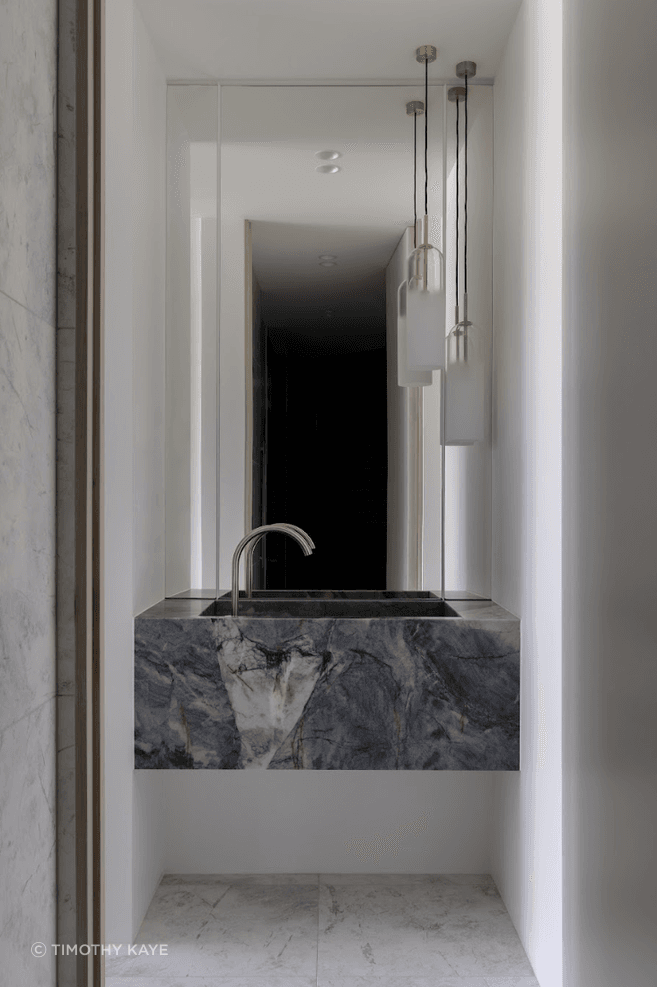 Inside, the colour palette is pared back – all whites, beiges, greys and blacks.
