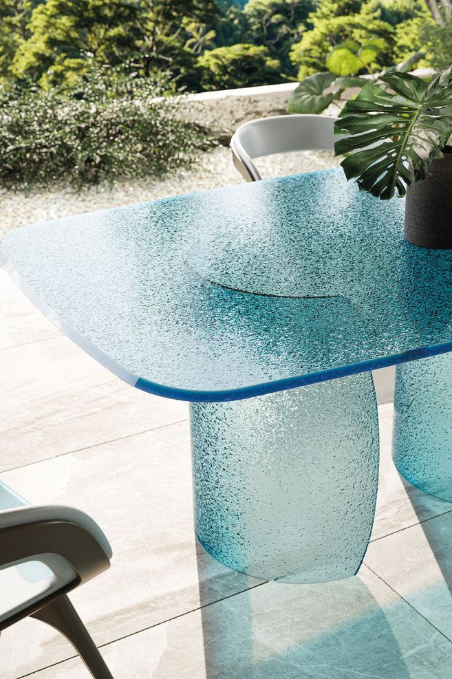 Petalo dining table featuring a base and top in Acqua glass in the colour blue