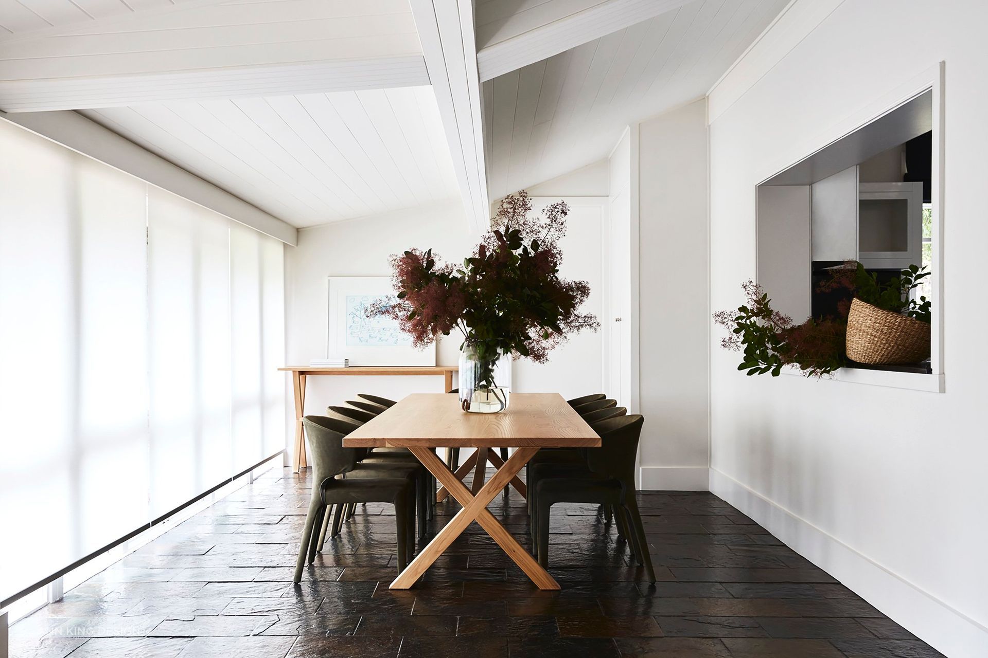 A central dining table and plenty of space between each chair are imperative to effective dining room design.