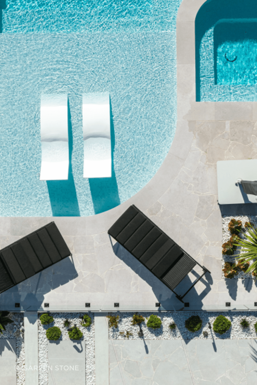 Phillip Bay Coastal Sanctuary by Design Native. Luna Chiaro Limestone in Alfresco finish anchors the pool and entertaining areas with clean lines and a refined neutral palette. Custom formats including 800×400mm and 1000×1000mm pavers showcase 2025's refined residential design.
