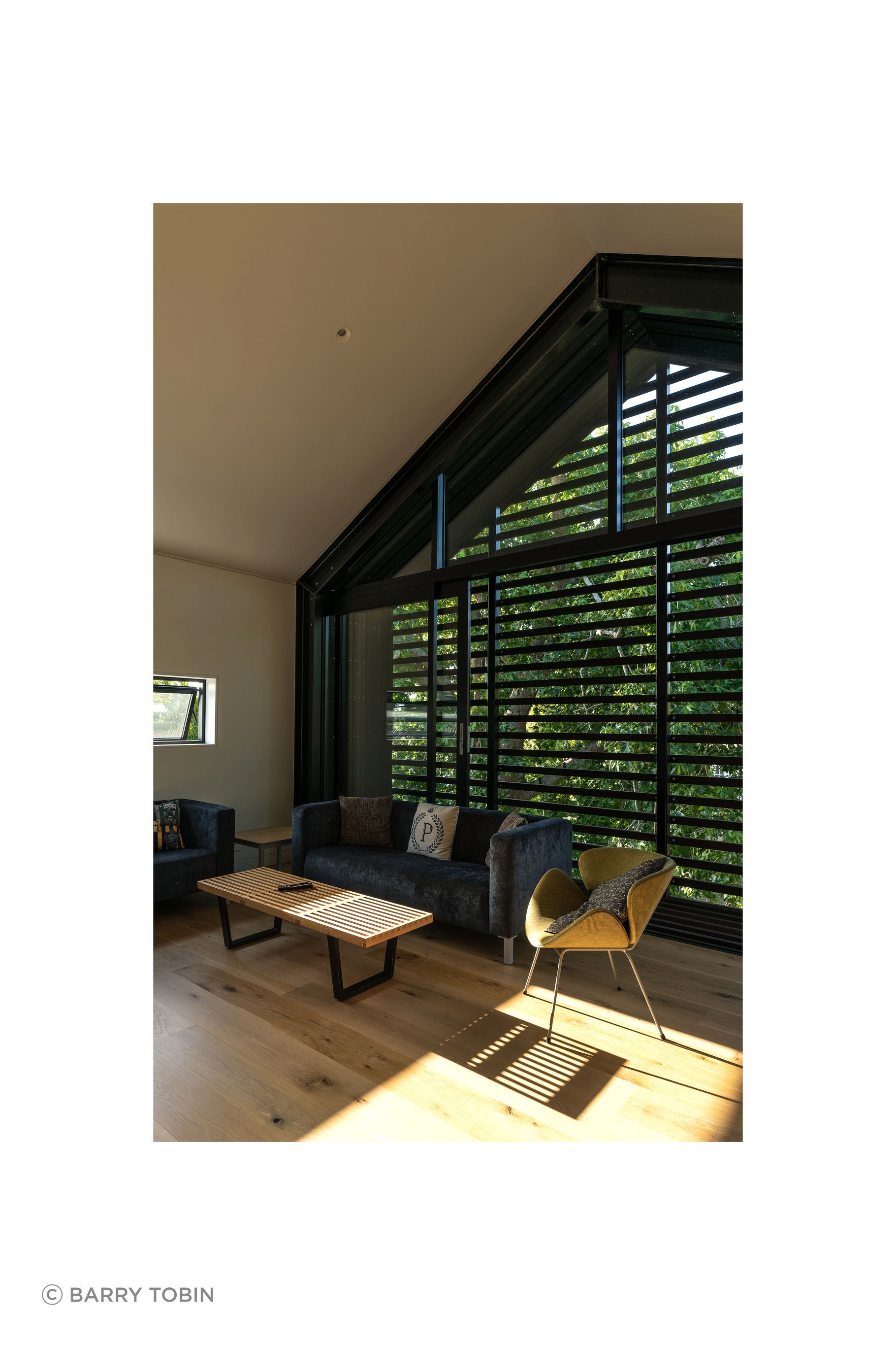 The upstairs living room is very useful with teenage children. “The kids tend to use it when they have friends over. In the summertime the large sliding windows can be left open to ventilate the house. We can leave it open without any security issues because it has the slats across it, which also double as sun control.”