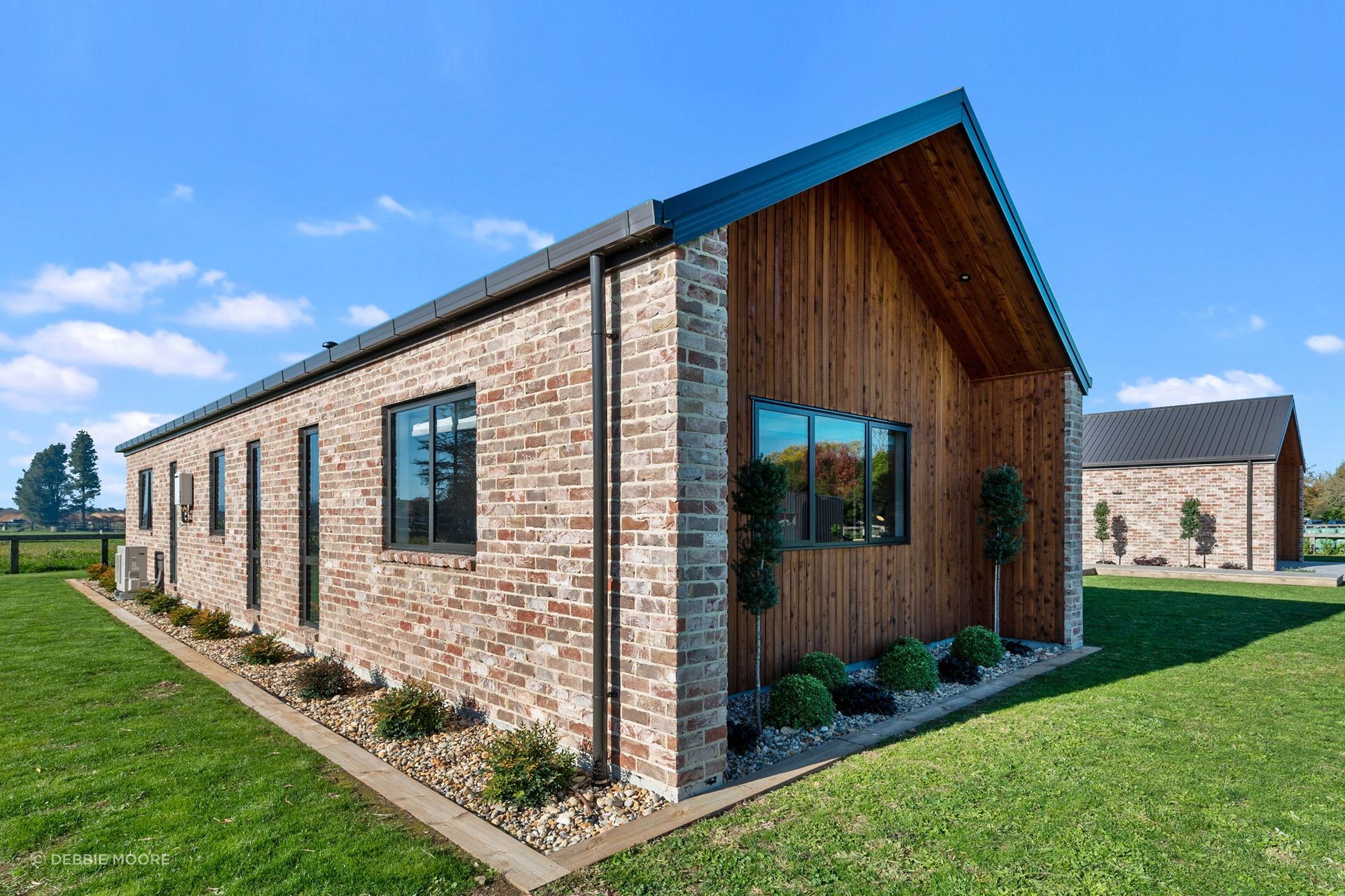 The Austral bricks from The Brickery are manufactured to look aged, a look that references reclaimed bricks from the Christchurch earthquakes that are no longer easy to find. The extended walls at the gable end provided room for extra planting.