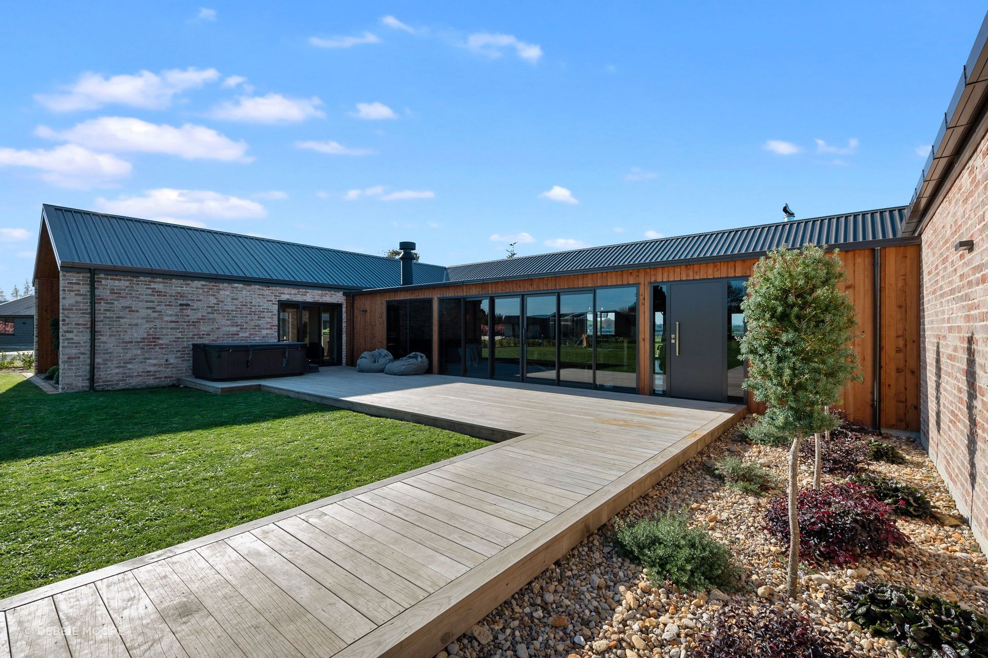 The concept for the house pivoted around the covered courtyard, with children’s rooms in one wing and master in the other. “I'm really happy that we did get the best bang for buck with the layout. It's all come together,” says Rob.