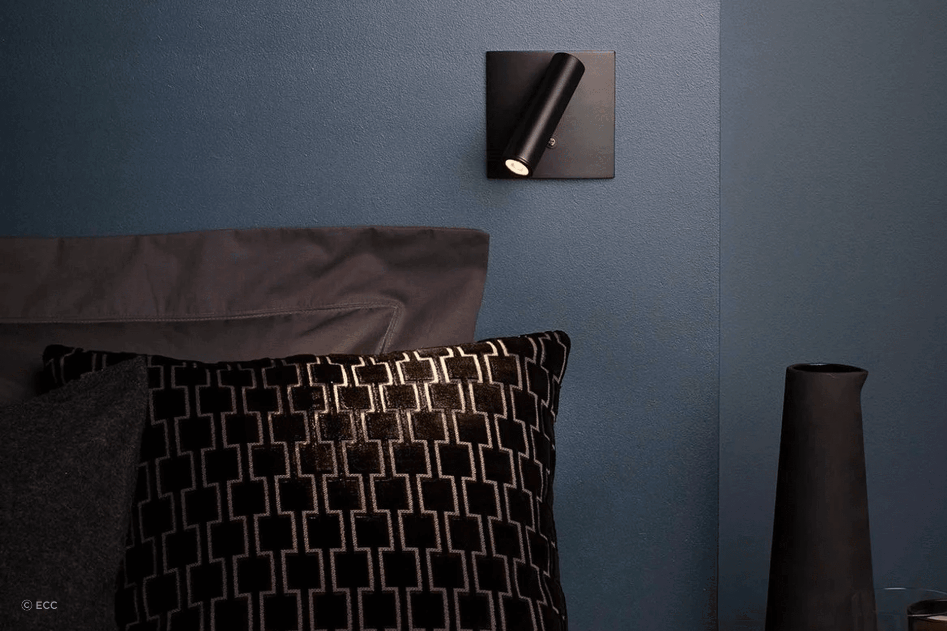 The Enna Square offers directional illumination for reading while making a distinct contribution to a bedroom.