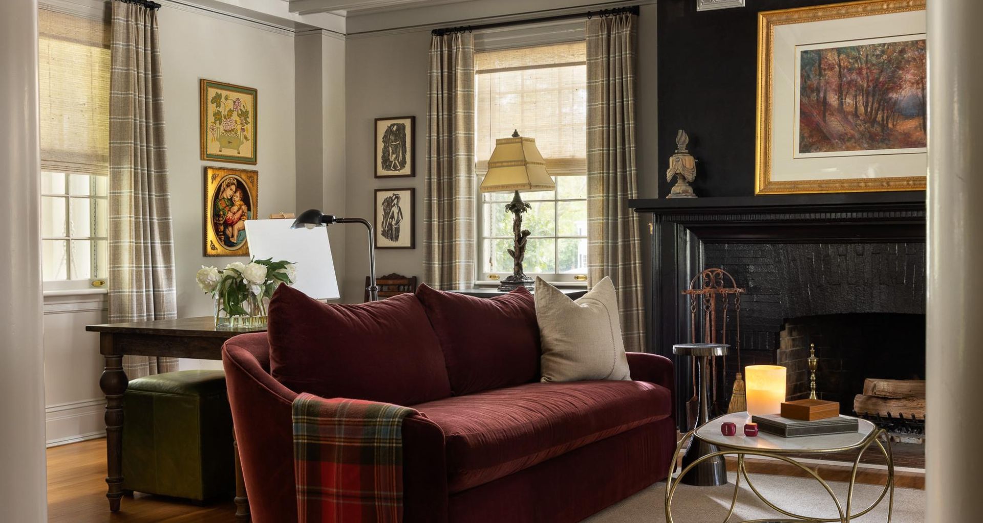Rich hues and charming antique pieces complement the timeless appeal of the Stoneleigh living room.