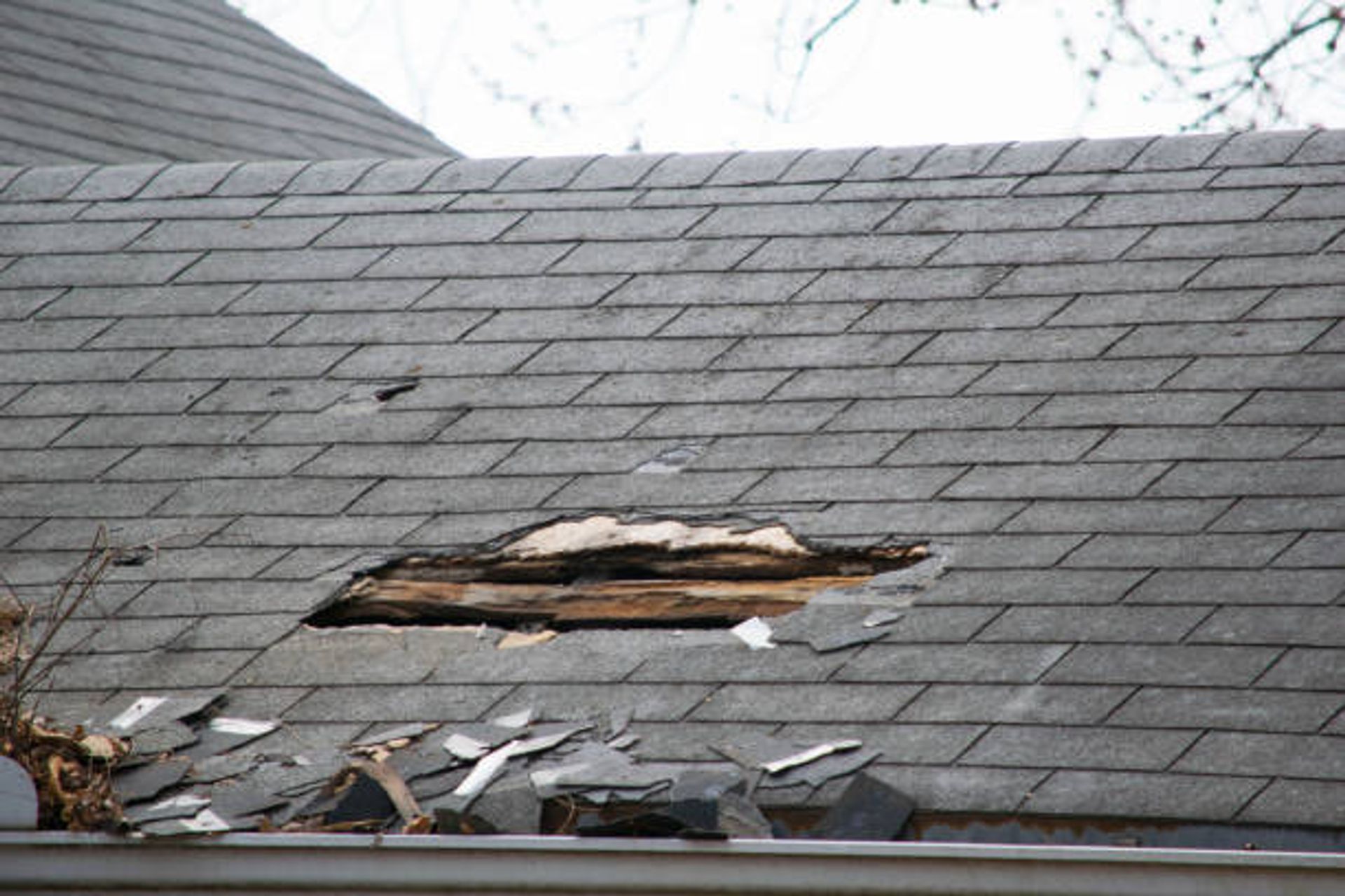 Broken Roof. Most likely need a roof replacement | Photo Credit – iStock