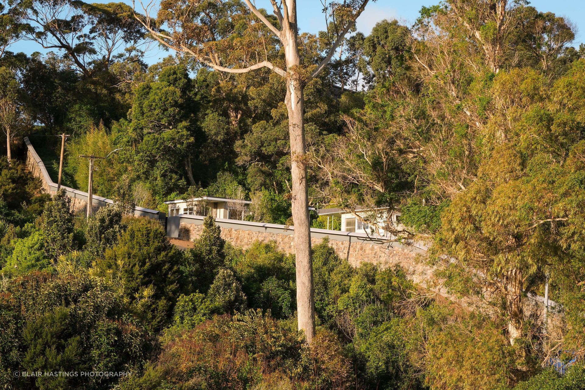 Although the zoo boundary wall didn't face the challenge of changing tides, the steep incline required careful planning and engineering.