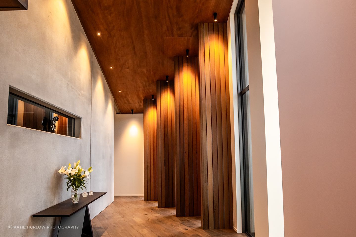 The timber fins in an internal corridor break up the journey to the bedrooms, creating enticing snapshots of the stunning view.