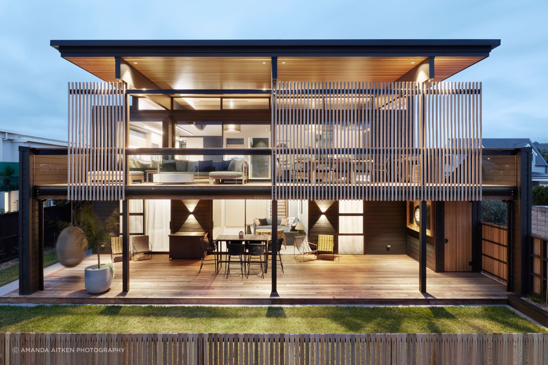 The elegant coastal holiday home in Whangamatā designed by Brendon Gordon of Brendon Gordon Architects captures the best of the views from any angle, and can accommodate the homeowners' multigenerational extended family.