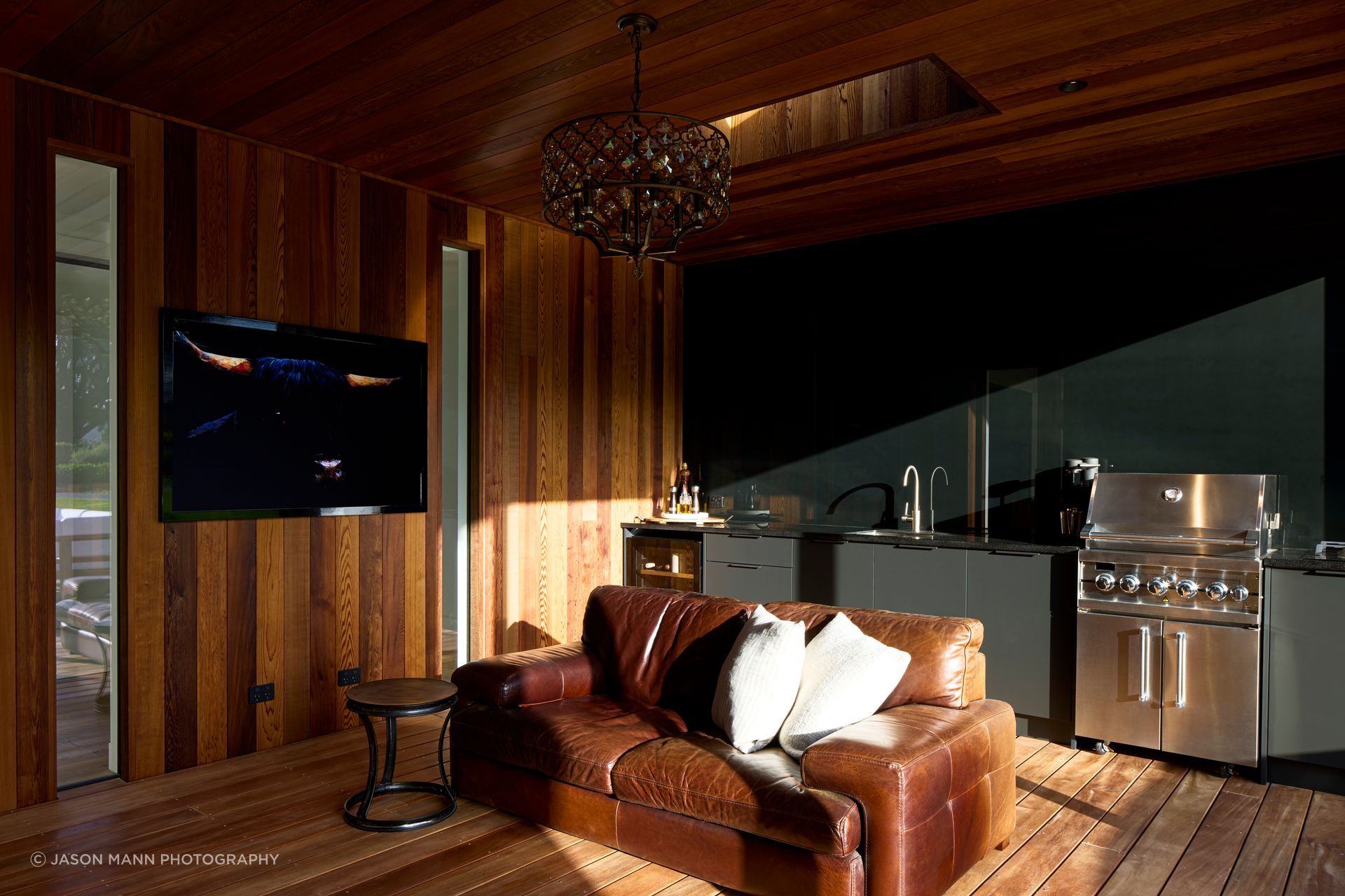 Complete with a chandelier, fireplace, television and barbecue, this is the Ferguson's favourite room in the house.