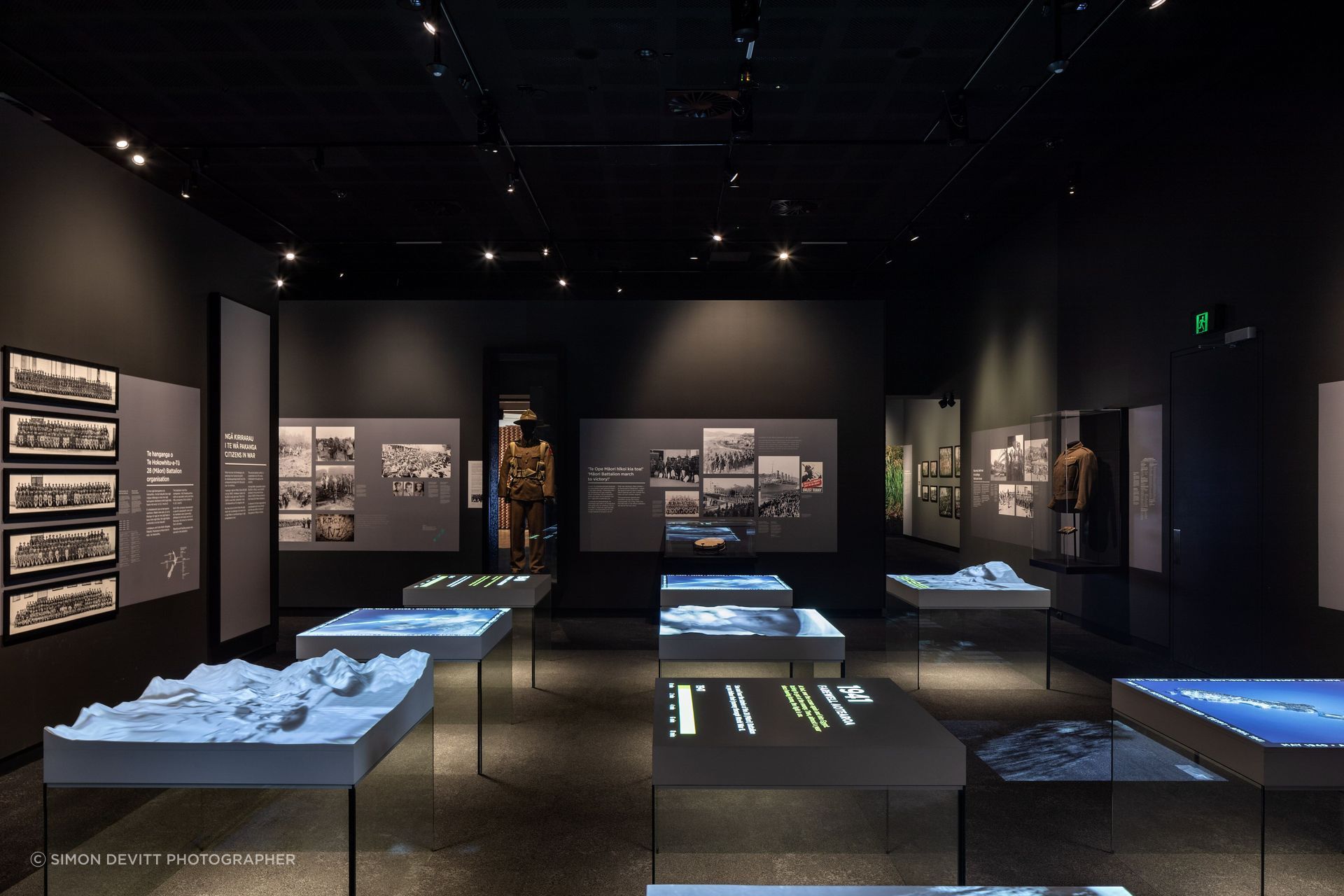 The main room of the museum is intentionally dark, in acknowledgement of the seriousness of the subject matter.