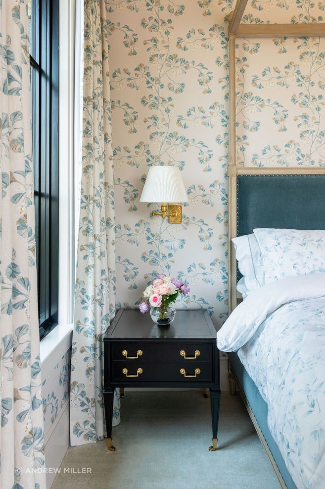 In the main bedroom, you'll find fabrics and curtains by Cowtan and Tout, a bed from Restoration Hardware, and bedside tables from Chairish.