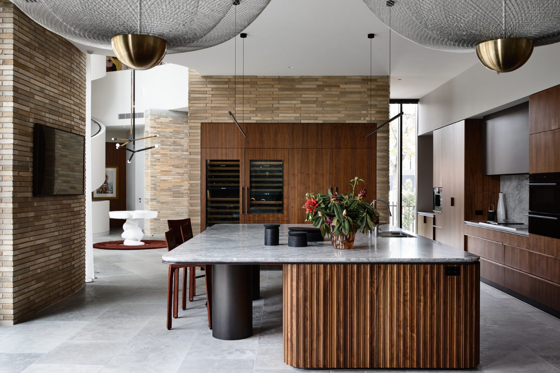 Rich materiality lends a feminine touch to this Brutalist entertainers’ paradise