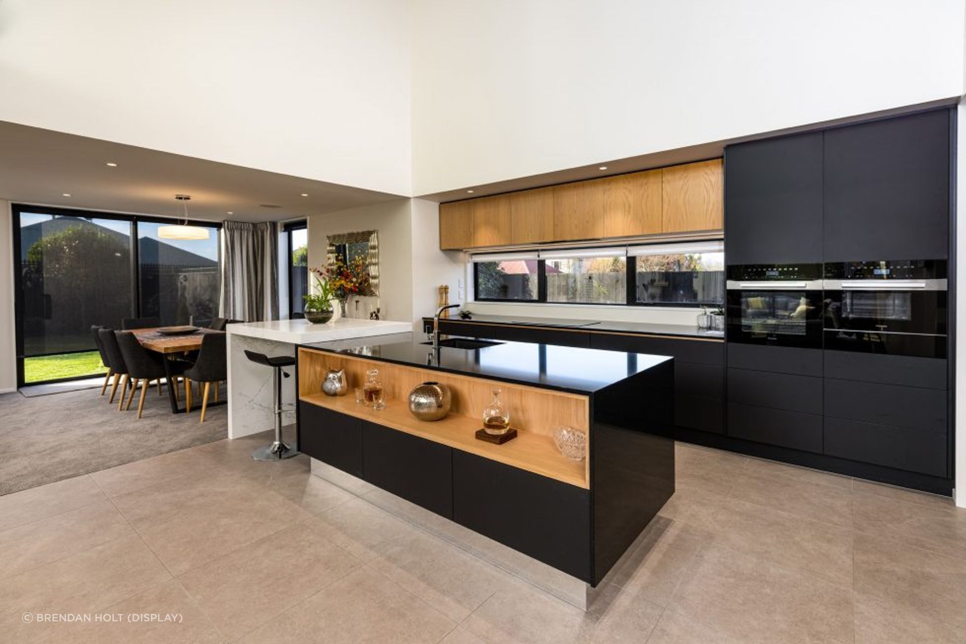 Similar to the home's exterior, a combination of contrasting materials have been used for the kitchen.