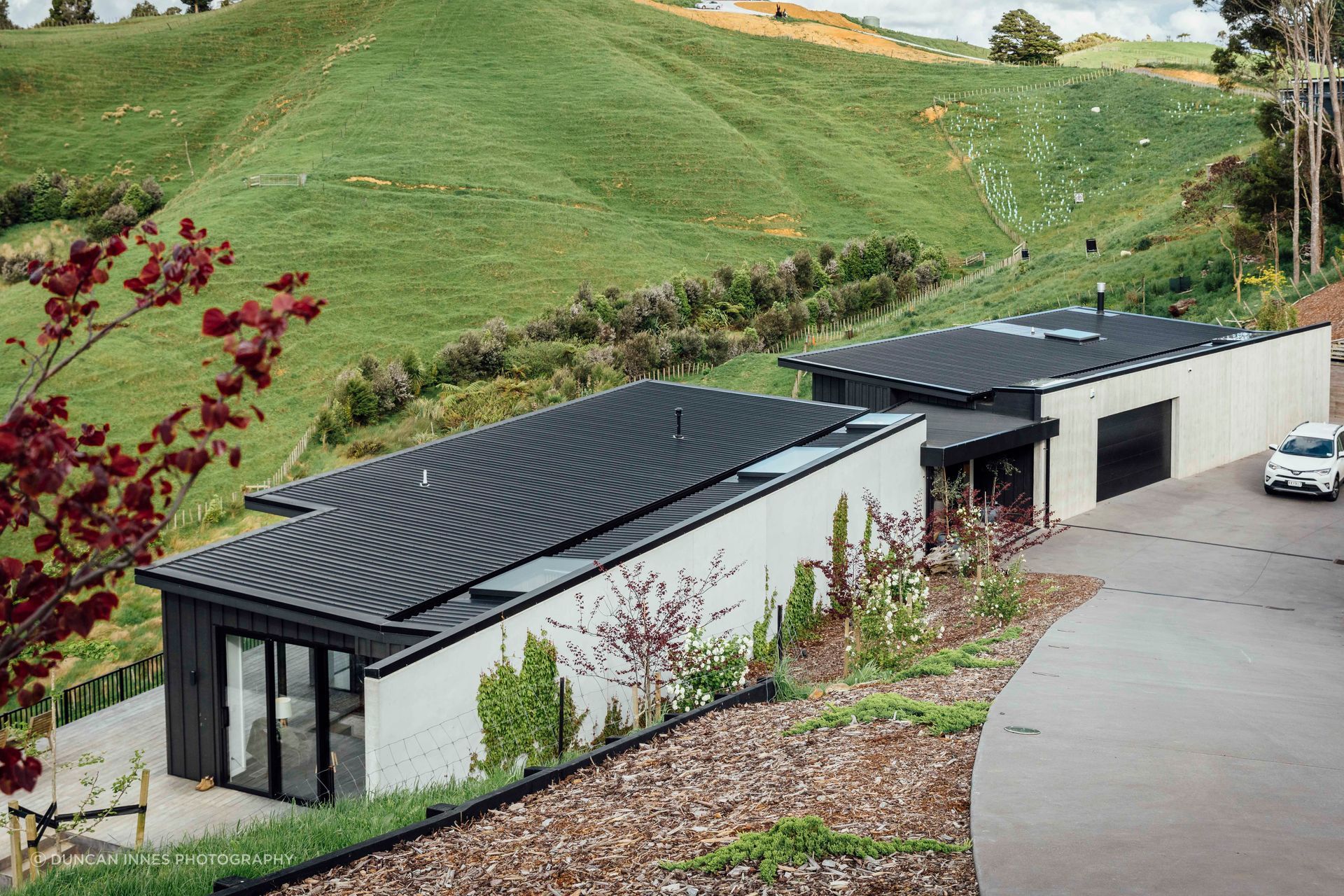The house in Auckland’s Bombay Hills designed by Brendon Hamill of David Reid Homes in Pukekohe. The stunning outlook belies the complications of the site but there’s plenty of room for the homeowners’ sheep, pigs and chickens.