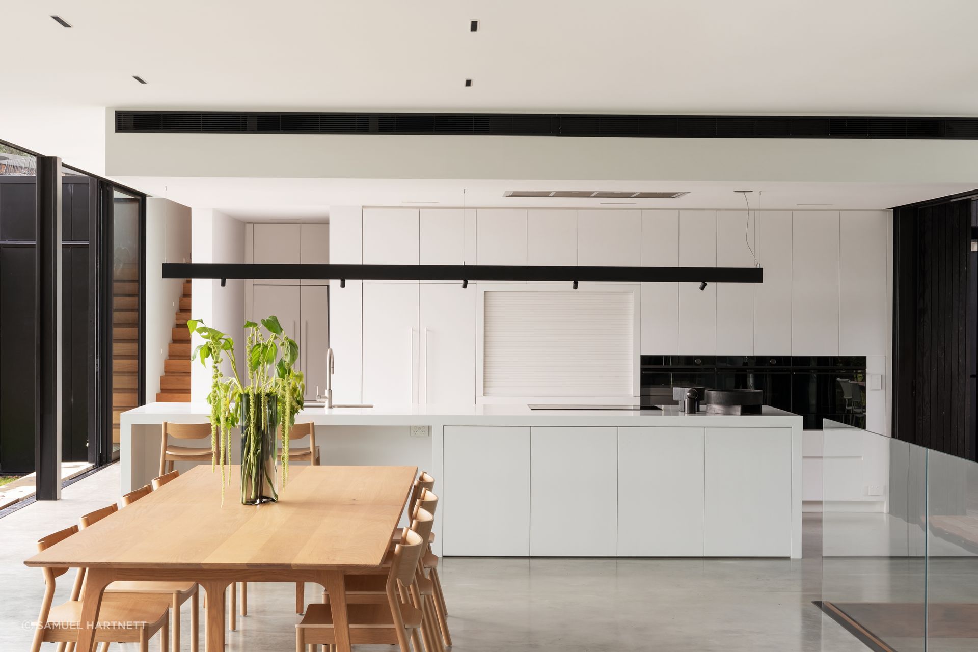 Daniel designed the kitchen to suit the client’s low-key approach. Most appliances are Fisher &amp; Paykel. The Swiss kitchen mixer is from Plumbline, and the benchtops are Corian.