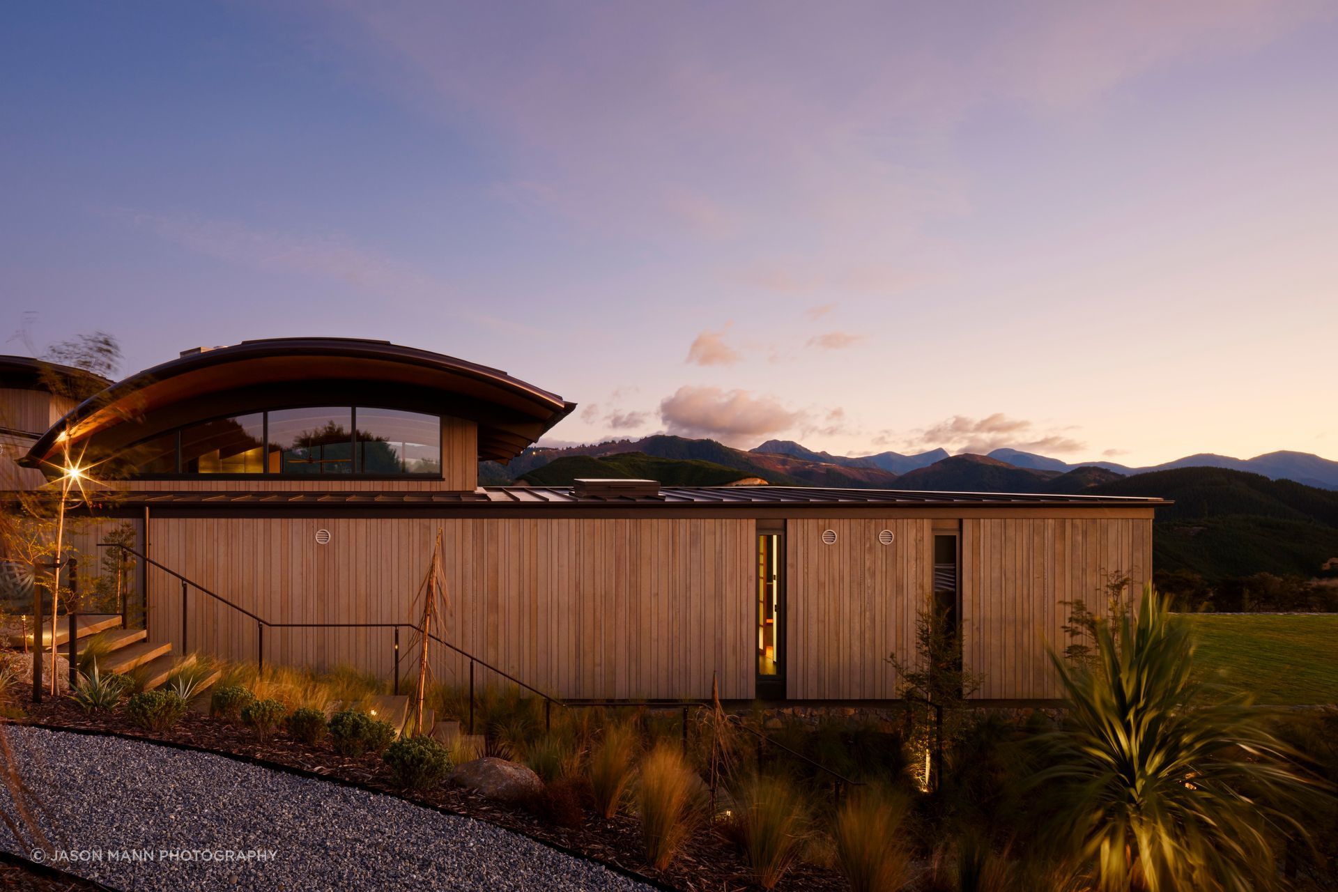 The vertical cedar shiplap is by Rosenfeld Kidson. The owners undertook an extensive amount of native planting.