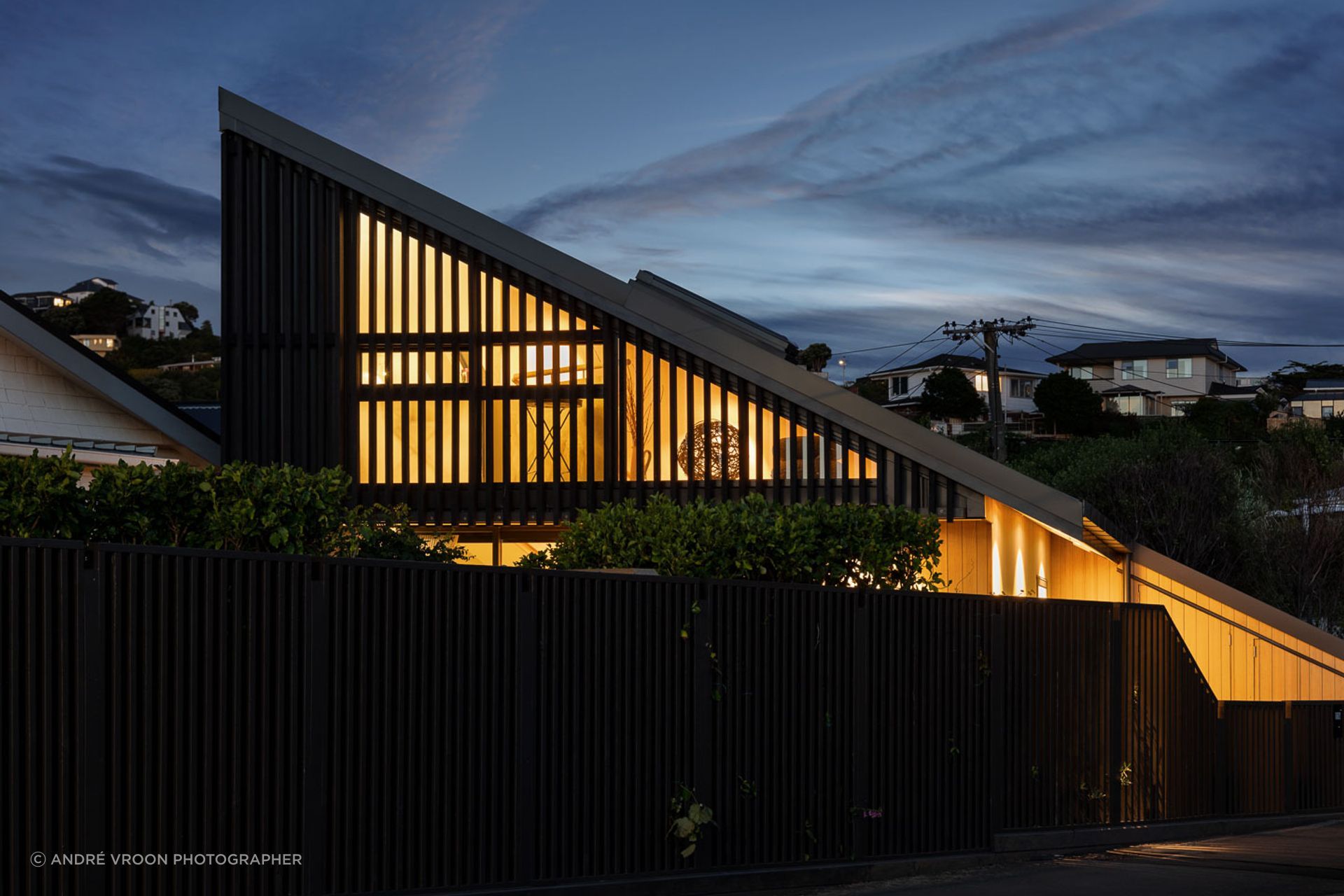 The sharp, angular shape of the home is dramatic when lit up at night.