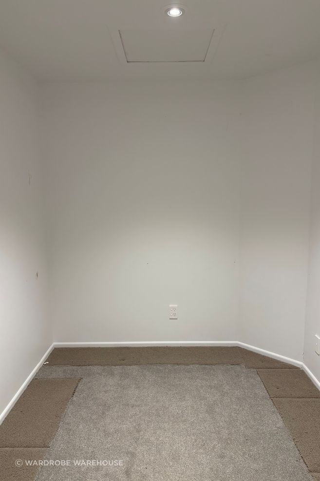 The walk-in had an angled wall in one back corner, so Richard needed to figure out the best way to approach the end section, accommodating the angled wall without sacrificing storage space.