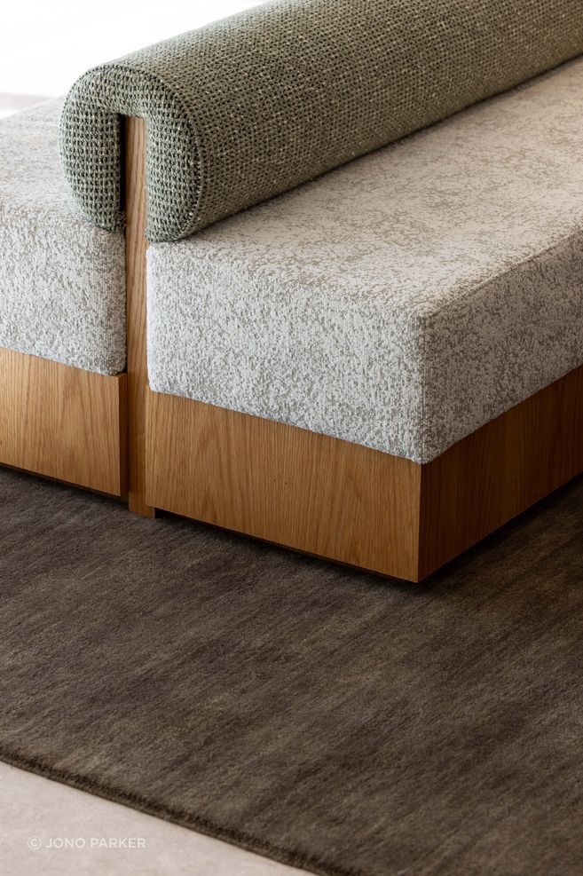 The custom ottoman was made by Evolution Construction &amp; Interiors.