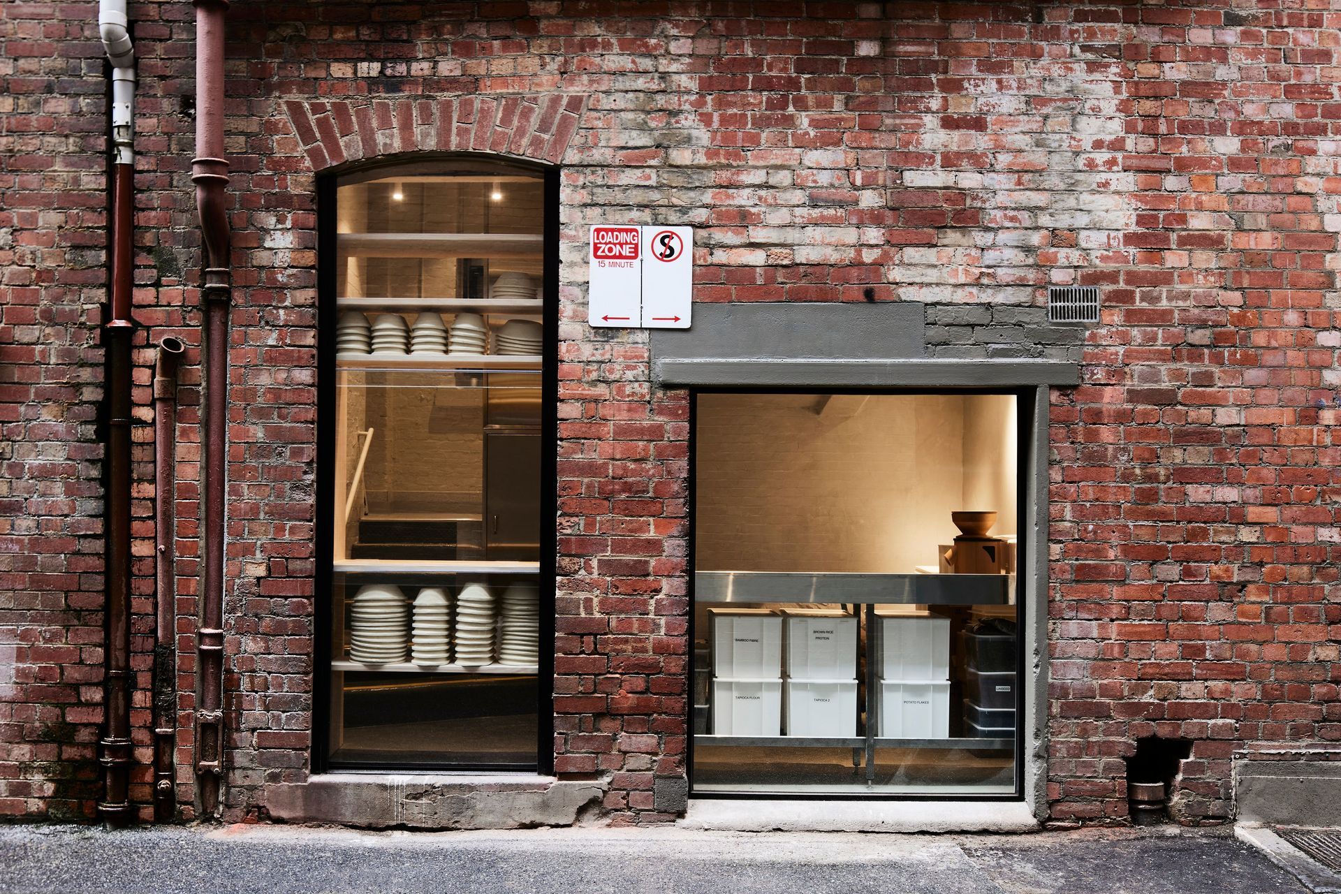 "One of the best design features is the use of the rear of the bakery, which looks into a laneway. Large panels of glass have been added to the heritage facade, showcasing the flour milling and mixing process. This window glows before dawn while Melbourne awakens to the sunrise," shares Felix Goodwin and Elena Nguyen.
