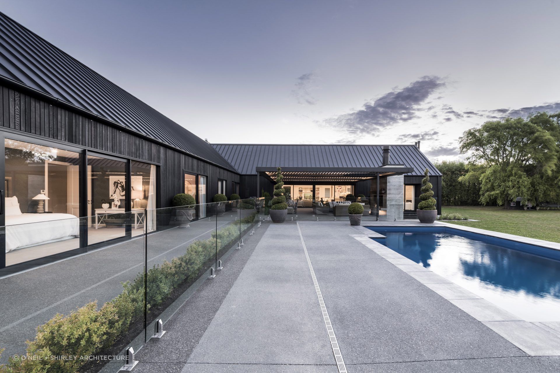 A reflective pond can be enjoyed from nearly every space in the home.