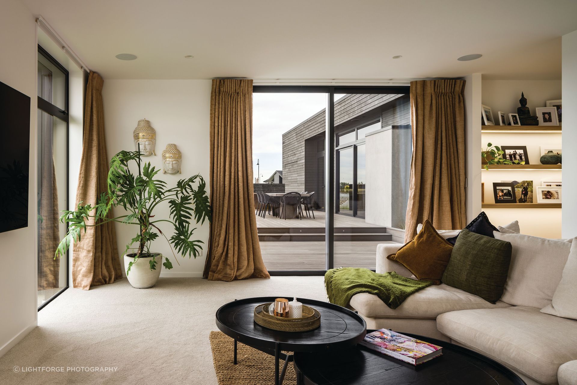 Soft textiles and creamy tones curate a calming spatial experience.